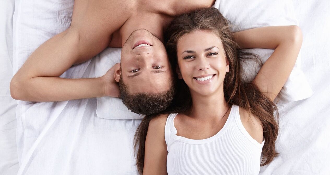 a woman in bed with a man who has increased potency